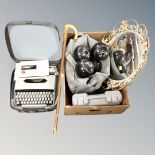 A box containing Taylor Lignoid Size 5 lawn bowls, a metal framed convex mirror, cased typewriter,