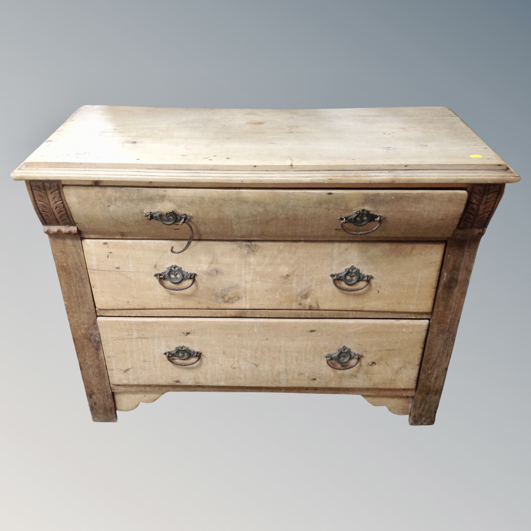 A 19th century pine three drawer chest,