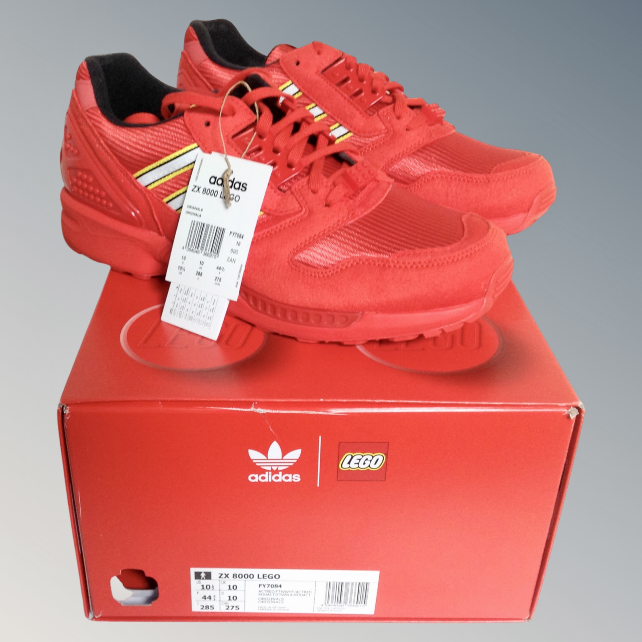 A pair of Adidas ZX8000 lego original trainers, red, size 10, as new in box.