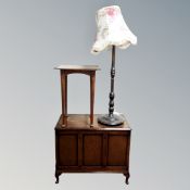 An Edwardian oak occasional table together with an oak panelled blanket box and a standard lamp