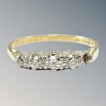 An 18ct yellow gold four stone diamond ring, size P, 2.2g.