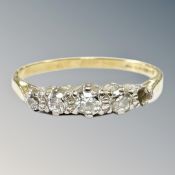 An 18ct yellow gold four stone diamond ring, size P, 2.2g.