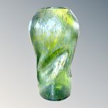 A Loetz green mottled iridescent glass vase, of crumpled form, unsigned, height 23cm.