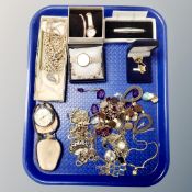 A tray containing Ingersoll triumph pocket watch, costume necklaces, gilt metal jewelry,