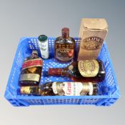 A box containing six bottles of alcohol to include Johnnie Walker Red Label, Grants Scotch Whisky,