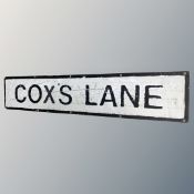 An aluminium street sign Cox's Lane.