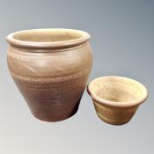 An earthenware planter together with matching plant pot.