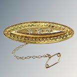 A 15ct gold diamond-set bar brooch, length 51mm. CONDITION REPORT: 5.