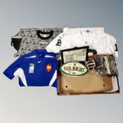 A box containing a Reebok NFL shirt, a Adidas Newcastle United T-Shirt,