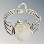 A white metal bangle set with crystal