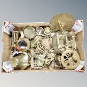 A box containing assorted brass wares to include trivets, sun dial, ornaments, bell, money box etc.