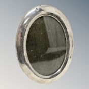 A silver oval photo frame,