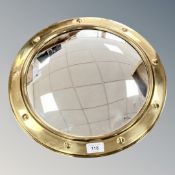 A brass porthole mirror,