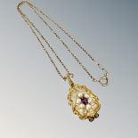 A 9ct gold amethyst and seed pearl pendant on box link chain, pendant 35mm long including suspender.