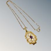A 9ct gold amethyst and seed pearl pendant on box link chain, pendant 35mm long including suspender.