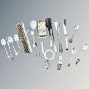 A group of silver cutlery and silver-mounted items, thimble, rattle,