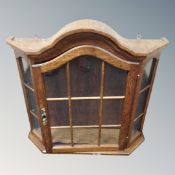 A Scandinavian oak wall mounted curio cabinet.