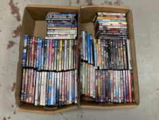 Two boxes of DVDs - approximately 100.