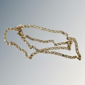 A gold plated chain set with stones