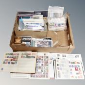 A box containing 20th century stamp albums containing world stamps, first day covers,