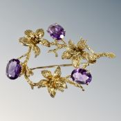 A 9ct gold amethyst floral bar brooch, length 46mm. CONDITION REPORT: 6.