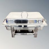 A stainless steel chafing dish with lid