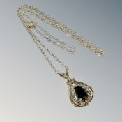 A 9ct gold sapphire heart pendant on chain CONDITION REPORT: 2.