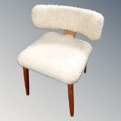 A 20th century Danish dressing table chair upholstered in a fleece fabric.