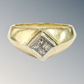 A gent's 18ct gold diamond ring, inset with four princess-cut stones, size W½.