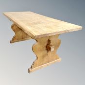 An oak refectory dining table.