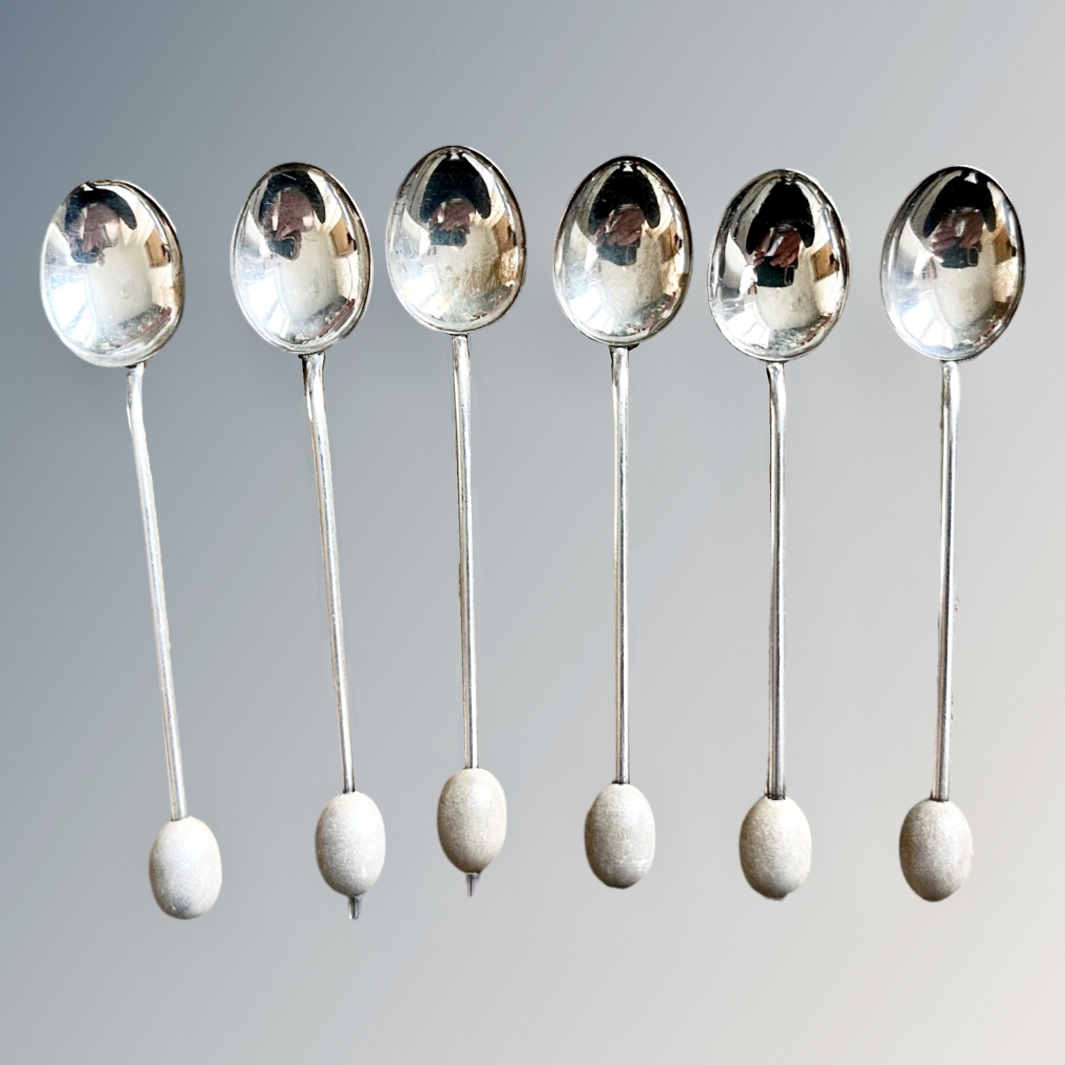 A set of six silver coffee spoons