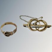 A 9ct gold brooch and similar buckle ring (broken) CONDITION REPORT: 5.6g gross.