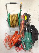 A Hozelock hose pipe on reel together with a Qualcast leaf blower,