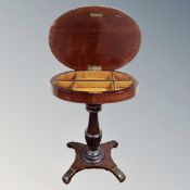A 19th century mahogany pedestal work table.