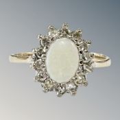 A 9ct yellow gold opal and diamond cluster ring, size O, 2.5g. CONDITION REPORT: 11.