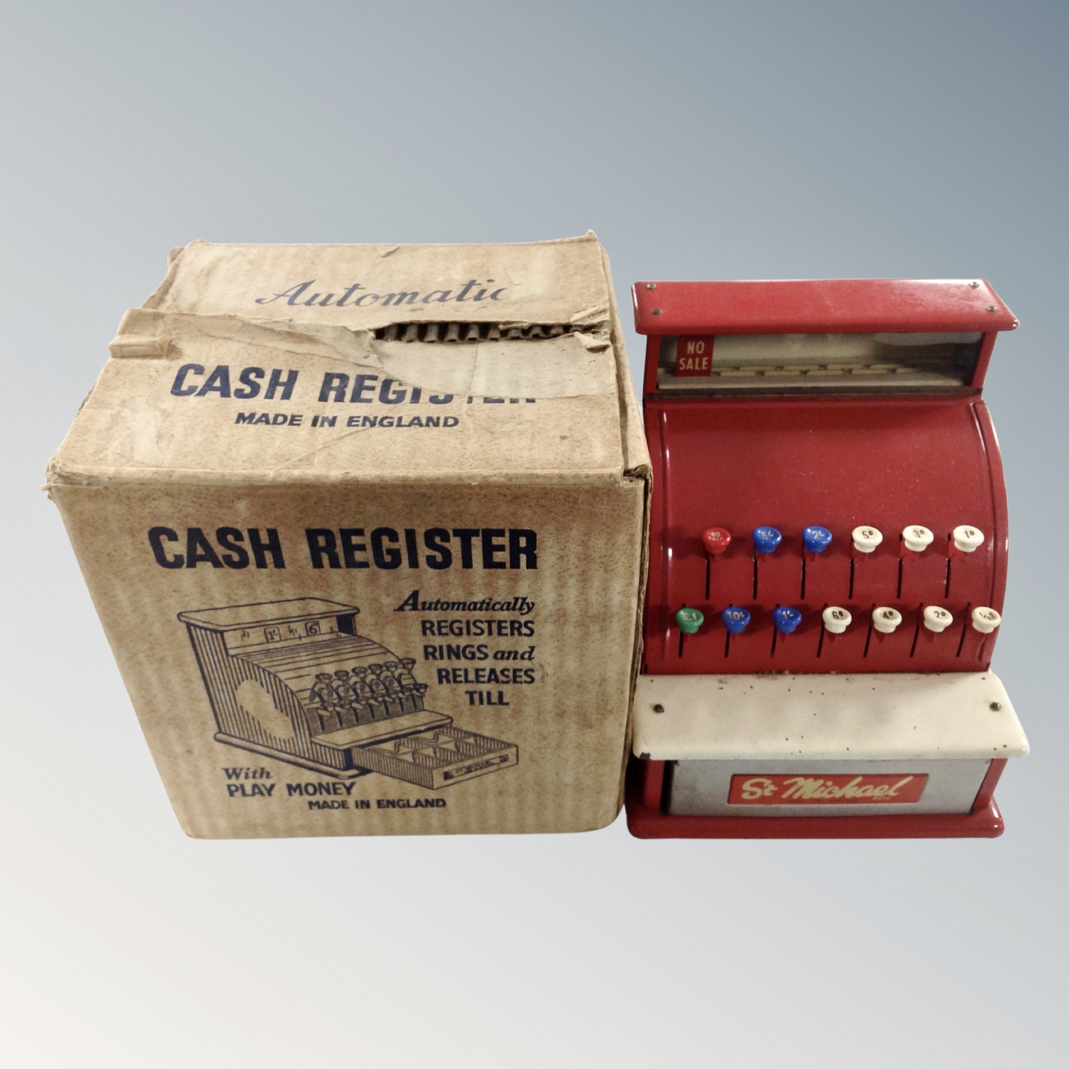 A vintage child's St Michael enameled cash register in original box.