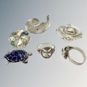 A group of silver/white metal items including brooch,