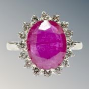 An 18ct white gold ruby and diamond cluster ring, size M/N, 4.5g.