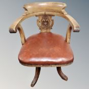 A 19th century oak swivel office chair
