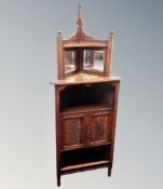 A late Victorian mahogany mirrored corner cabinet