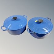 Two Le Creuset cast iron lidded cooking pots (blue).