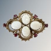 A gold, ruby and opal rope-twist brooch, width 41mm. CONDITION REPORT: 9.4g.