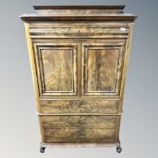 A 19th century flame mahogany double door cocktail cabinet fitted drawers,