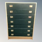 A mid 20th century Scandinavian seven drawer campaign style chest with brass drop handles,
