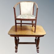 An Art Deco open tub armchair together with a library table.