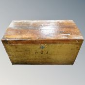 An antique pine blanket box.