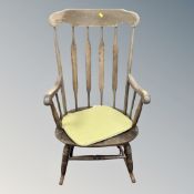 A spindle backed rocking chair