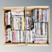 Two boxes containing approximately 100 dvds