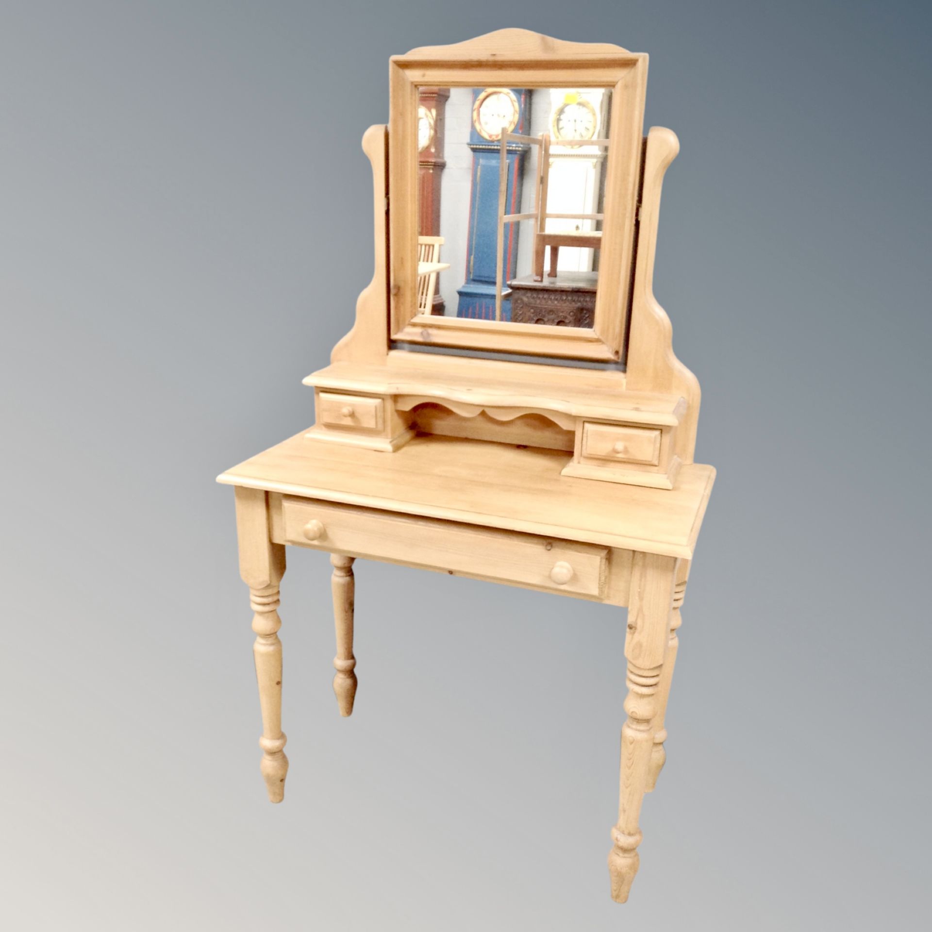 A striped pine dressing table fitted a drawer with mirror, width 87 cm.