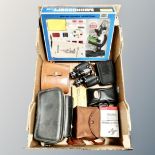 A box of Tasco student microscope set in original box, Frank 8 x 30 field glasses,